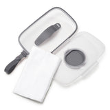 Clear Skip Hop Grab & Go Wipes Case with gray trim, open lid, and a stack of white wipes.