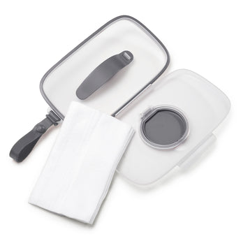 Clear Skip Hop Grab & Go Wipes Case with gray trim, open lid, and a stack of white wipes.