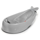 Gray whale-shaped Skip Hop Moby Smart Sling 3-Stage Tub with a light gray mesh sling insert.