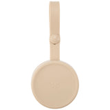 Skip Hop beige silicone pacifier holder with a top strap and small star logo.