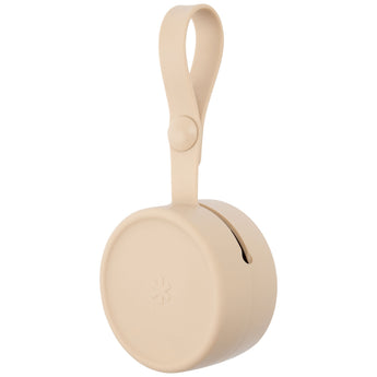 Skip Hop beige silicone pacifier holder with a loop strap and a small starburst logo.