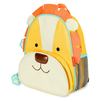 Yellow Skip Hop Zoo Lion toddler backpack with orange mane, mesh side pocket, and front snack pouch.