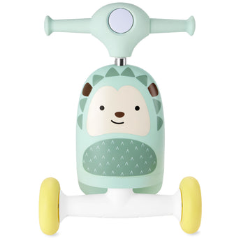 Mint green Skip Hop Zoo 3-in-1 hedgehog ride-on toy with yellow wheels, front view.