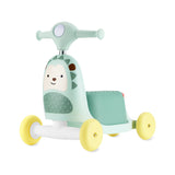 Skip Hop Zoo 3-in-1 mint green hedgehog ride-on toy with yellow wheels, a push walker and scooter.