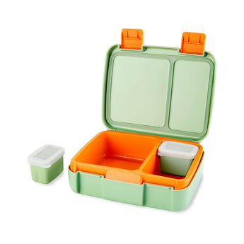 Open Skip Hop Zoo bento box with light green exterior, orange interior, two compartments, and two small lidded containers.