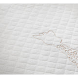 White quilted organic cotton blanket with Sophie la girafe embroidery.