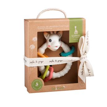 Sophie la girafe So'Pure Teething Colo'rings, a white giraffe teether with colorful rings, in a brown gift box.
