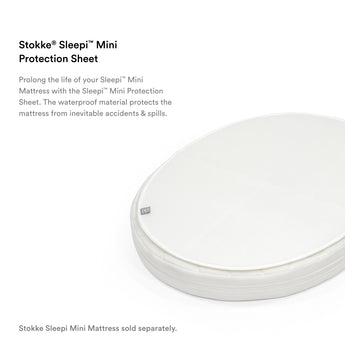 White oval Stokke Sleepi Mini Protection Sheet, waterproof and textured, protecting a mattress.