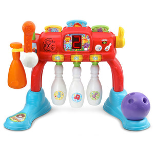 Colorful toy bowling set with pins and ball on a white background