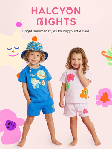 Two children wearing bright summer outfits with colorful graphics on a light pink background.
