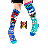 Colorful cartoon-themed socks on a light blue background