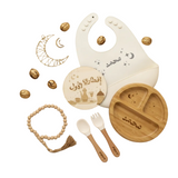 Baby utensils and accessories with Arabic text on a beige background