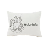 White pillow with unicorn design and 'Gabriela' text on a white background