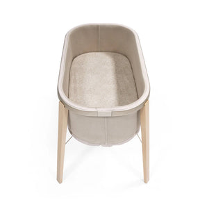 Stokke Snoozi Fitted Sheet lifestyle in bassinet