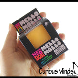 NeeDoh Mello Mallo Yellow lifestyle in hand